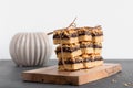 Viennese cookies with currants are neatly stacked and tied with a thread on a wooden board Royalty Free Stock Photo