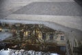 Viennese neighborhood reflected in a puddle