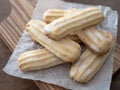 Viennese shortbreads on a wooden board. Italian buttery shortbread cookies with glazed tops Royalty Free Stock Photo