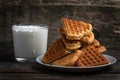 Viennese waffles cookies and glass of milk on rustic wooden background. Heart shape form biscuits cookies Royalty Free Stock Photo