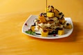 Viennese waffles with ice cream and slices of mango doused with chocolate Royalty Free Stock Photo