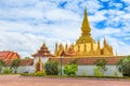 Vientiane Lao-July 6 2019 : Pha That Luang with blue sky background, Historical ancient golden pagoda religion place, View at Royalty Free Stock Photo