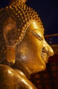 Face of the golden Buddha statue at the Wat Ong Teu Mahavihan Temple of Heavy Buddha in Vientiane, Laos. Royalty Free Stock Photo