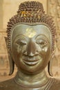 Head of the damaged old Buddha statue located at the outside wall of the Hor Phra Keo museum building in Vientiane, Laos.