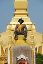 Statue of the King Chao Anouvong in front of the Pha That Luang stupa in Vientiane, Laos. Royalty Free Stock Photo