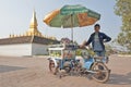 VIENTIANE, LAOS - JANUARY 19, 2012: local street vendor at Wat P