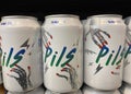 Closeup of cans Lervig german craft beer pils in shelf of supermarket