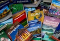 Travel around the world - View on pile of lonely planet travel guide books from different