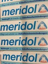 View on carton boxes meridol tooth paste in shelf of german supermarket