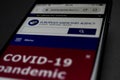 Close up of mobile phone screen with website of EMA european medicines agency with information about covid-19 pandemic vaccinatio