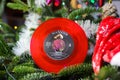 Close up of red vintage vinyl record single with famous Elvis Presley christmas song in decorated fir tree