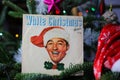 Close up of vintage vinyl record cover single with famous Bing Crosby white christmas song in decorated fir tree