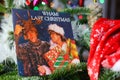 Close up of vintage vinyl record cover single with famous Wham last christmas song in decorated fir tree