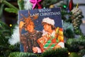 Close up of vintage vinyl record cover single with famous Wham last christmas song in decorated fir tree