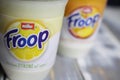 Closeup of label on plastic cup with logo lettering of muller froop fruit yoghurt desert