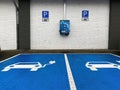 View on free charging station for electric cars on parking lot of aldi store