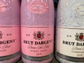 View on bottles brut dargent pinot noir wine in shelf of german supermarket Royalty Free Stock Photo