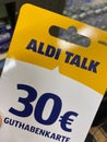 Close up of mobile phone 30 Euro recharging card of Aldi talk provider in store