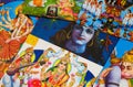 Close up of pile of classical Indian colorful paintings about mythology of hindu gods.