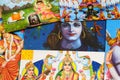 Close up of pile of classical Indian colorful paintings about mythology of hindu gods.