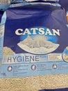 Closeup of bags Catsan cat litter in shelf of german store
