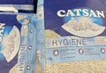Closeup of bags Catsan cat litter in shelf of german store