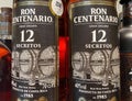 Closeup of bottles Centenario rum from Costa Rica in shelf of german store