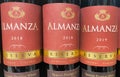 Closeup of bottles spanish red Wine Almanza reserva in shelf of german store