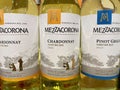 Closeup of italian Mezzacorona variety white wine bottles in shelf of german supermarket