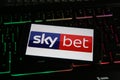 Closeup of smartphone screen with logo lettering of online betting provider skybet on computer keyboard Royalty Free Stock Photo