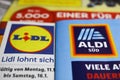 Macro closeup of weekly printed advertising inserts from german discounter companies lidl and aldi