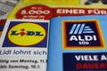 Macro closeup of weekly printed advertising inserts from german discounter companies lidl and aldi