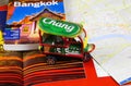 Travel guide, photo book, model of tuk tuk and city map for planning a trip to Bangkok