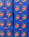 Closeup of many stacked blue boxes Barilla penne rigate noodles in shelf of german supermarket Royalty Free Stock Photo