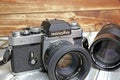 Closeup of one Minolta XE-5 single lens analog film reflex camera with tele objective Royalty Free Stock Photo