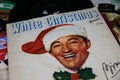 Closeup of Bing Crosby white christmas single vinyl record cover from 1942 focus on center