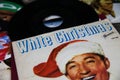 Closeup of Bing Crosby white christmas single vinyl record cover from 1942 focus on center