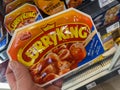 Closeup of hand holding package Meica ready to eat Curryking sausages in german supermarket