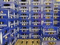 Closeup of many blue stacked Flensburger beer bottle crates on euro palette in storage