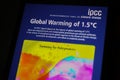 Closeup of mobile phone screen with logo lettering of ipcc intergovernmental panel of climate change Royalty Free Stock Photo