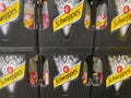 Closeup of stacked crates Schweppes tonic water in german supermarket