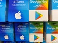 View on apple itunes, app store and google music play gift voucher cards in shelf of german supermarket