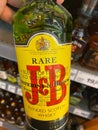 View on isolated bottle J and B whiskey in shelf of german supermarket