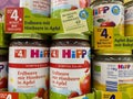 View on isolated jars Hipp fruits food in shelf of german supermarket