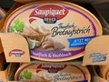 View on isolated Saupiquet tuna bread spread can in shelf of german supermarket