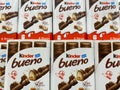 View on stack Kinder Bueno chocolate bar boxes in shelf of german supermarket