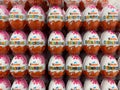 View on stacked kinder surprise eggs in shelf of german supermarket