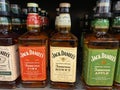 View on variety of bottles Jack Daniels spiced whiskey in shelf of german supermarket