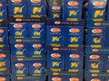 View on wall stacked blue Barilla noodles carton boxes in german supermarket