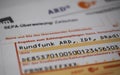 Close up of bank transfer form from german radio and tv broadcast service GEZ, ARD and ZDF Beitragsservice